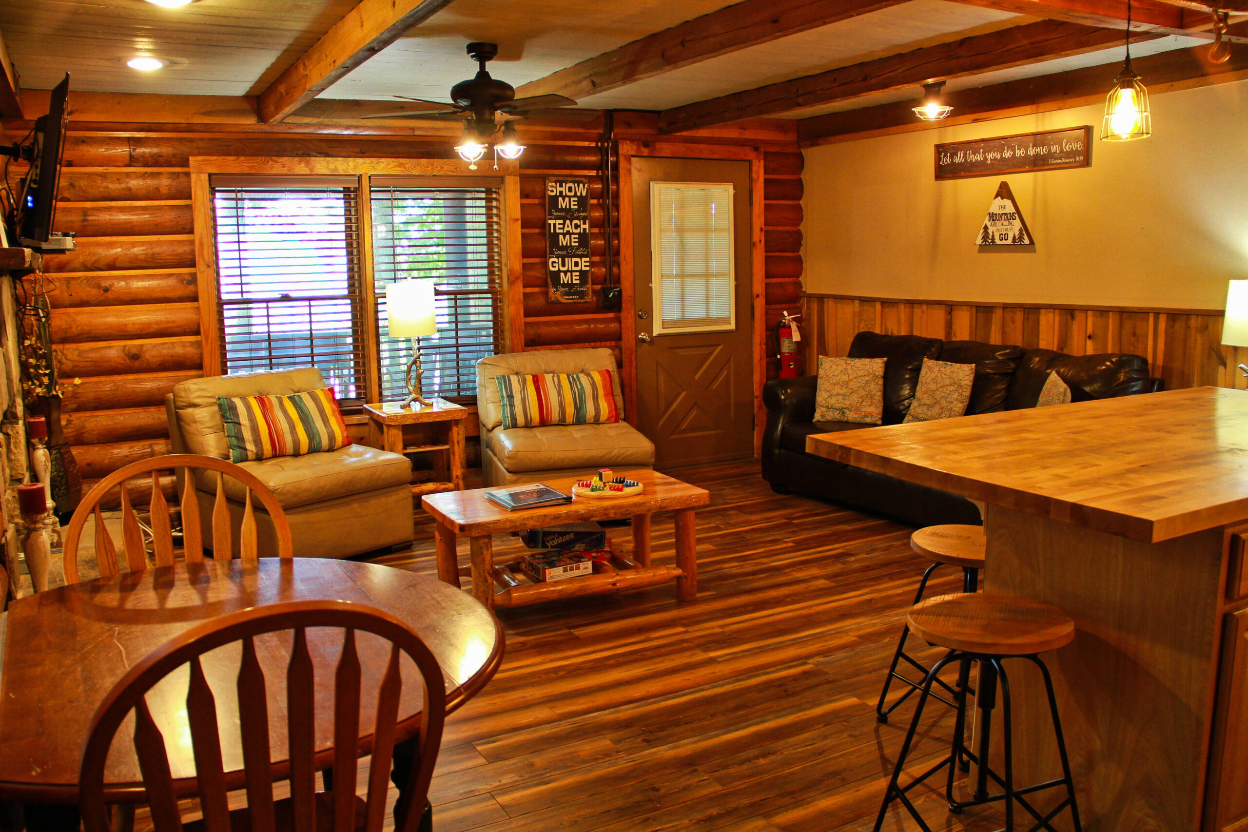 view of living room area with chairs and sofa