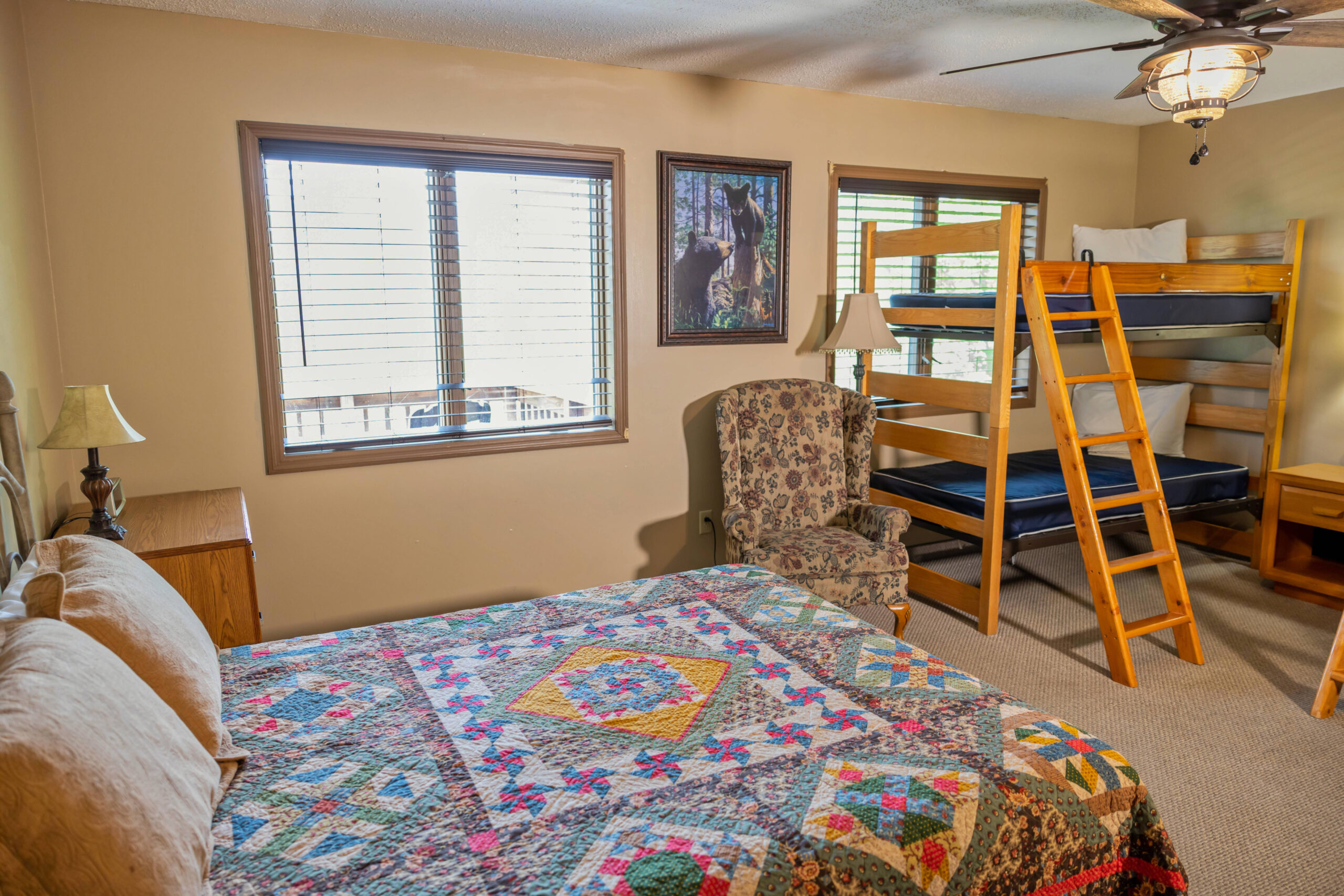 bedroom with queen bed and bunk bed