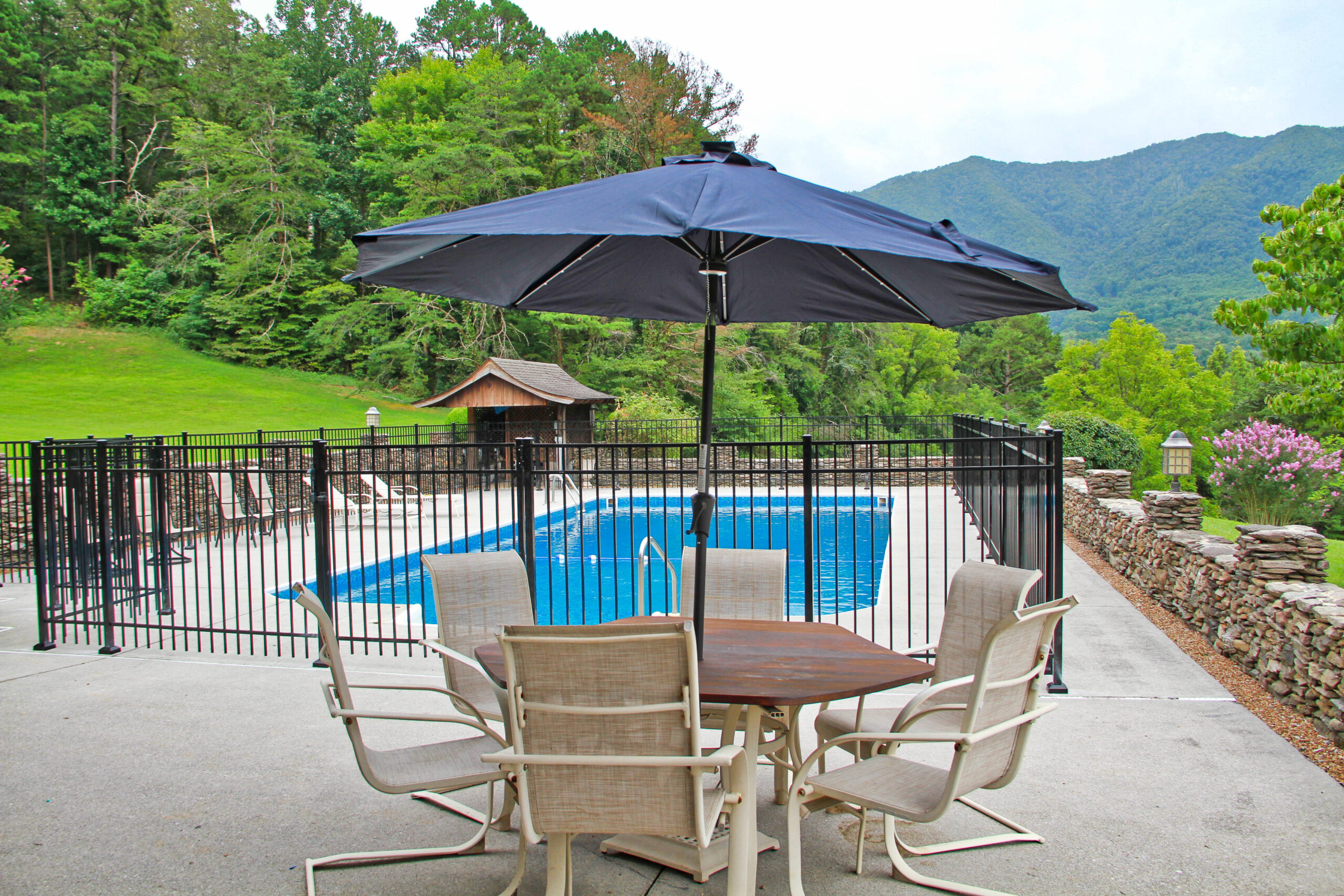 pool area umbrella table with chairs