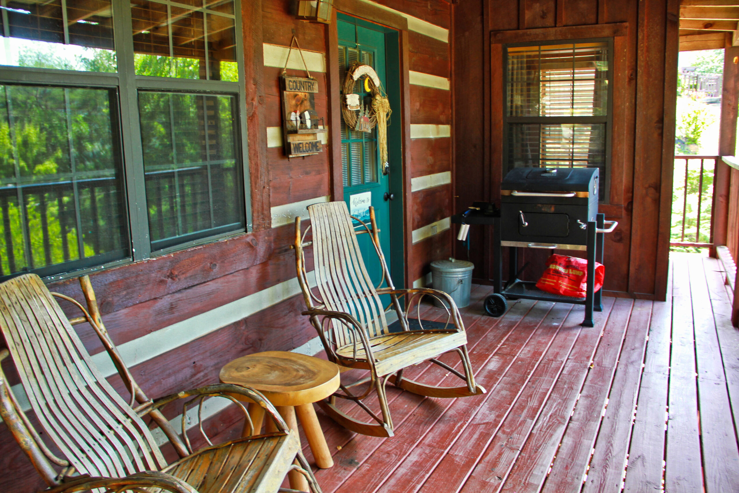 porch area with grill and chairs